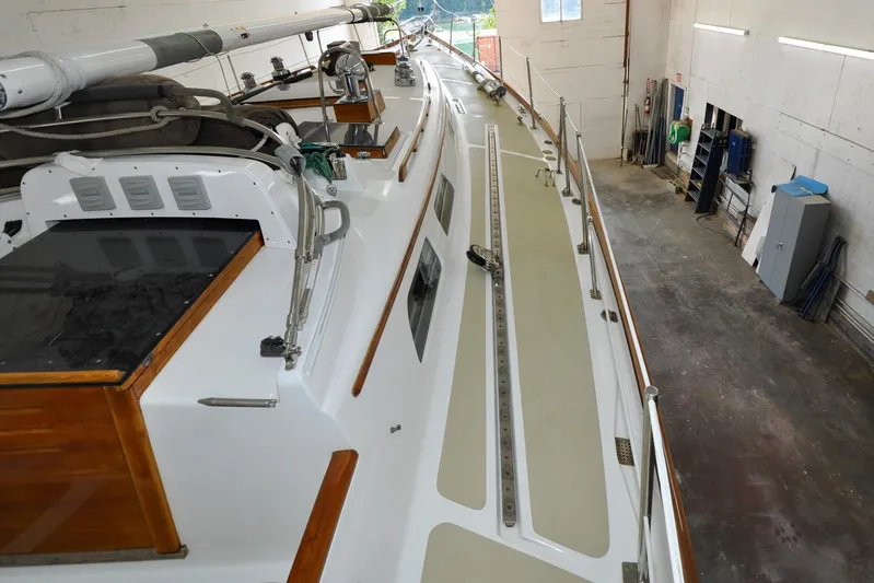Night Train Yacht Photos Pics 1986 Hinckley Sou'wester 51 sailboat in a workshop, showcasing deck and rigging details.