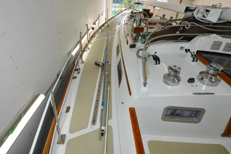 Night Train Yacht Photos Pics 1986 Hinckley Sou'wester 51 sailboat deck with winches and rigging in a storage facility.