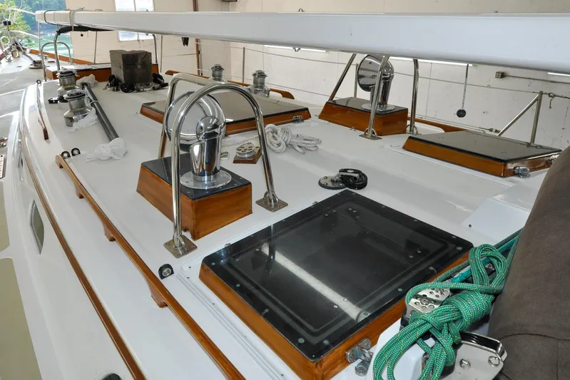 Night Train Yacht Photos Pics 1986 Hinckley Sou'wester 51 sailboat deck with winches and ropes in a marina.