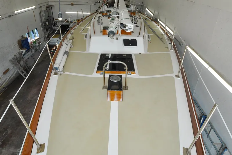 Night Train Yacht Photos Pics 1986 Hinckley Sou'wester 51 sailboat deck in a workshop setting.