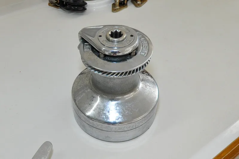 Night Train Yacht Photos Pics Winch on 1986 Hinckley Sou'wester 51 sailboat deck, showcasing polished metal finish.