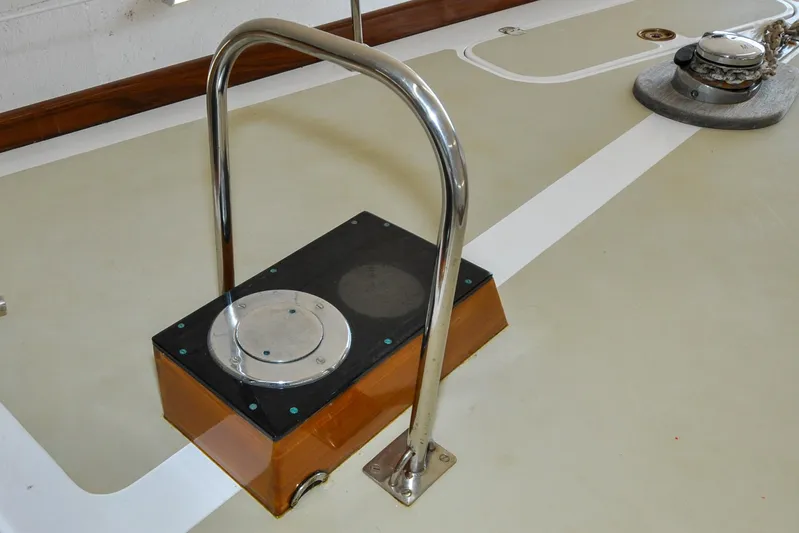 Night Train Yacht Photos Pics Deck detail of a 1986 Hinckley Sou'wester 51 sailboat, featuring a metal handrail.