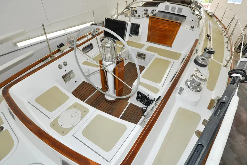 Night Train Yacht Photos Pics 1986 Hinckley Sou'wester 51 sailboat cockpit with wooden accents and steering wheel.