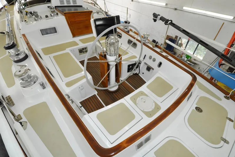 Night Train Yacht Photos Pics 1986 Hinckley Sou'wester 51 sailboat cockpit with wooden accents and steering wheel.