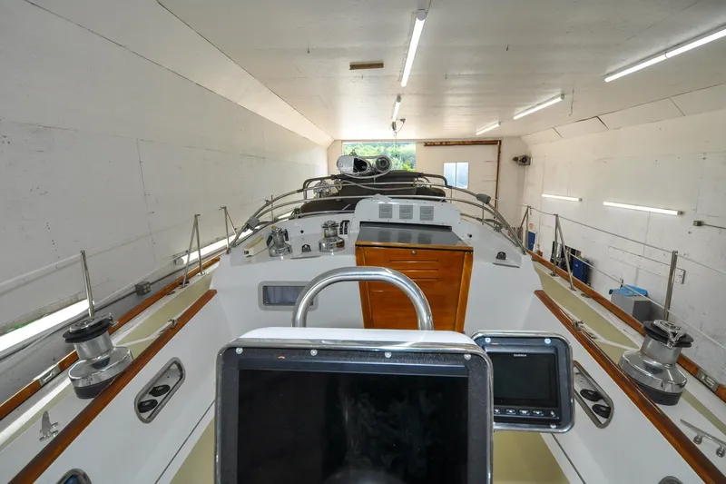 Night Train Yacht Photos Pics 1986 Hinckley Sou'wester 51 sailboat in a well-lit indoor storage facility.