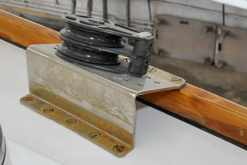 Night Train Yacht Photos Pics Winch on 1986 Hinckley Sou'wester 51 sailboat, mounted on polished metal and wood surface.