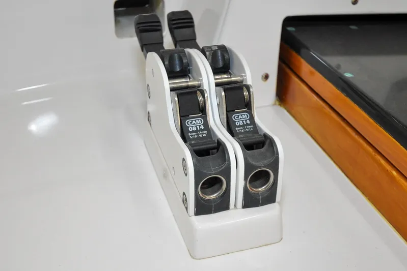 Night Train Yacht Photos Pics Cam cleats on 1986 Hinckley Sou'wester 51 sailboat, close-up view.