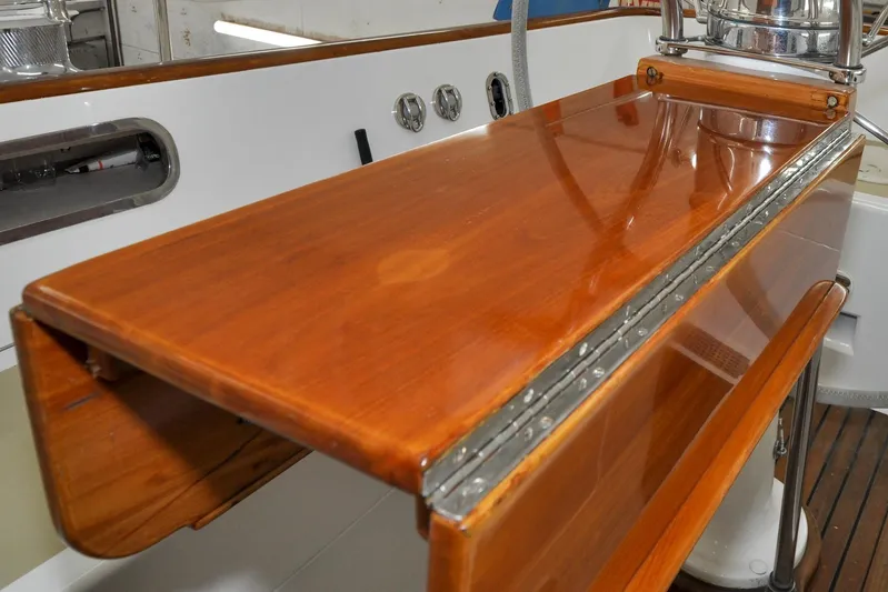 Night Train Yacht Photos Pics Polished wooden surface on 1986 Hinckley Sou'wester 51 yacht, showcasing craftsmanship and elegance.