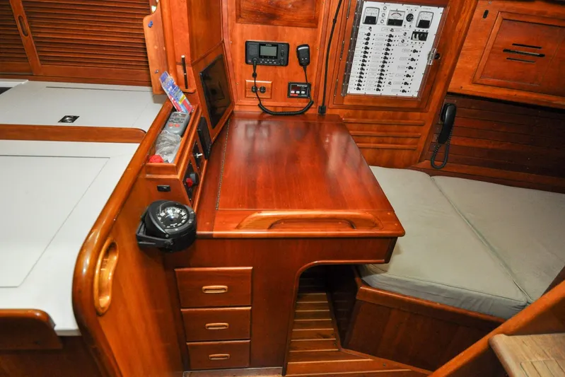Night Train Yacht Photos Pics Hinckley Sou'wester 51 (1986) yacht interior with navigation station and control panel.