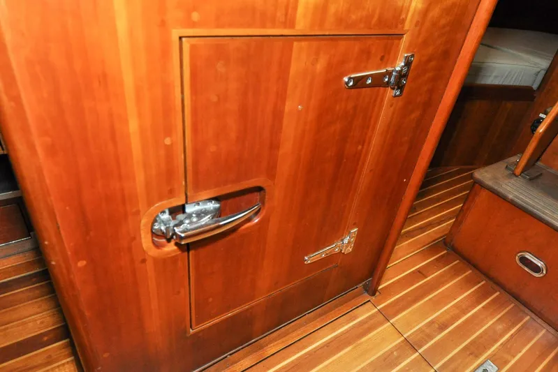 Night Train Yacht Photos Pics Hinckley Sou'wester 51 (1986) interior with wooden cabinetry and flooring detail.
