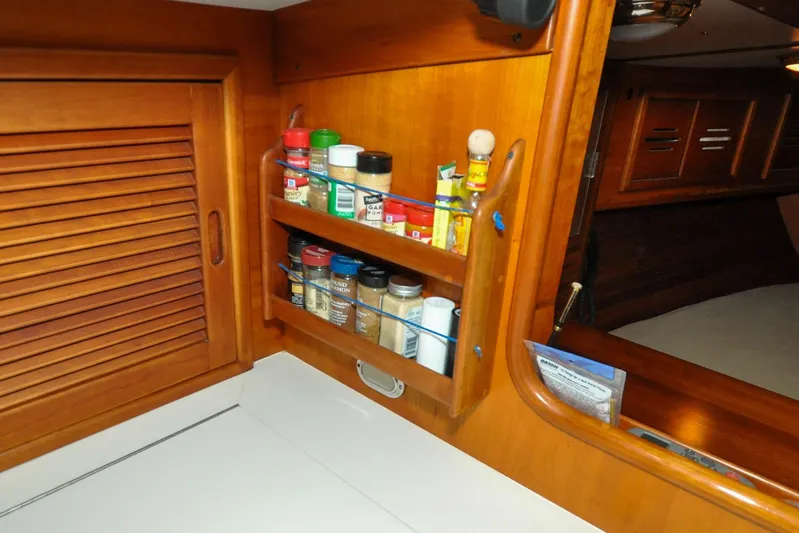 Night Train Yacht Photos Pics Wooden spice rack in 1986 Hinckley Sou'wester 51 yacht interior kitchen.