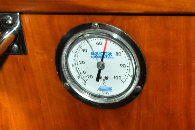 Night Train Yacht Photos Pics Thermometer on 1986 Hinckley Sou'wester 51 yacht, displaying temperature in Fahrenheit and Celsius.