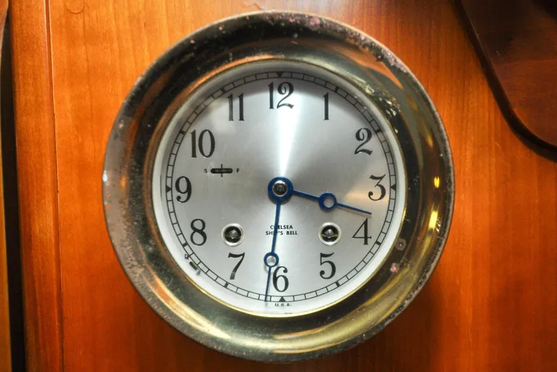 Night Train Yacht Photos Pics Vintage Chelsea ship's bell clock on 1986 Hinckley Sou'wester 51 yacht.