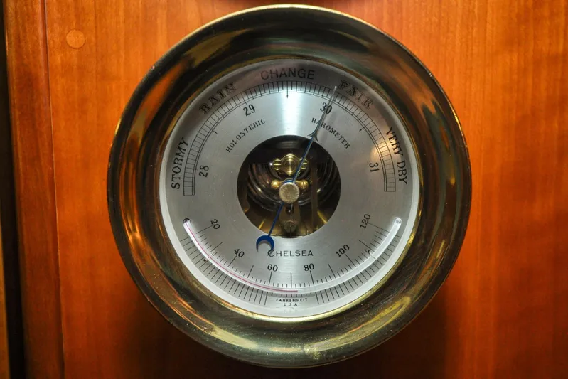 Night Train Yacht Photos Pics Barometer on 1986 Hinckley Sou'wester 51 yacht, displaying weather conditions.