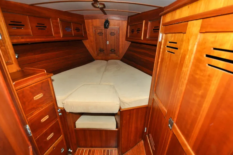 Night Train Yacht Photos Pics 1986 Hinckley Sou'wester 51 yacht cabin with wooden interior and cozy bed.