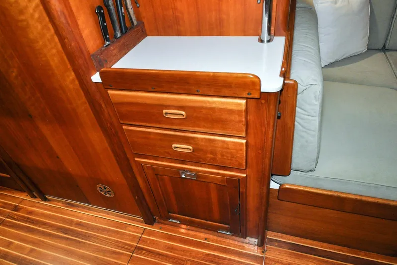 Night Train Yacht Photos Pics Interior of 1986 Hinckley Sou'wester 51 yacht with wooden cabinetry and seating.