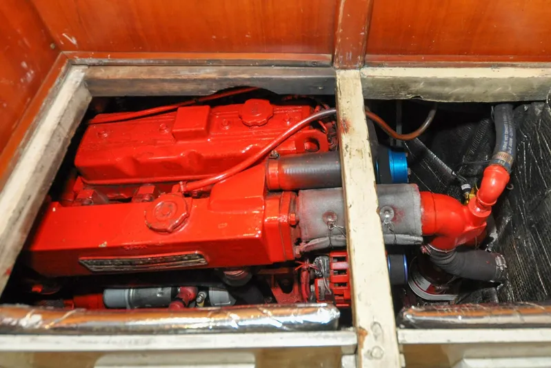 Night Train Yacht Photos Pics Engine compartment of 1986 Hinckley Sou'wester 51 sailboat, featuring a red engine.