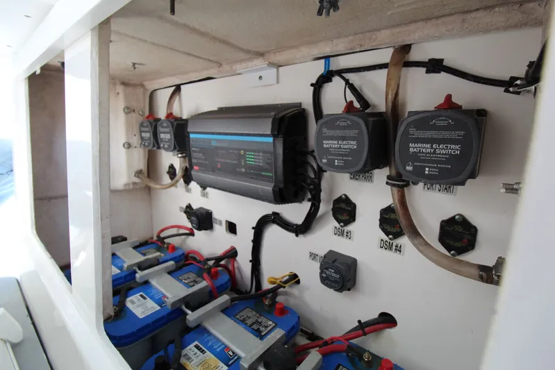 Reel Heavy Yacht Photos Pics Electrical system of a 2009 Everglades 320 Center Console boat, featuring marine battery switches.