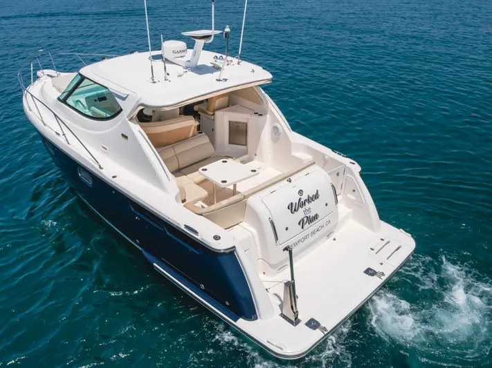 Worked The Plan Yacht Photos Pics 2009 Tiara Yachts 3900 Sovran cruising on clear blue water.