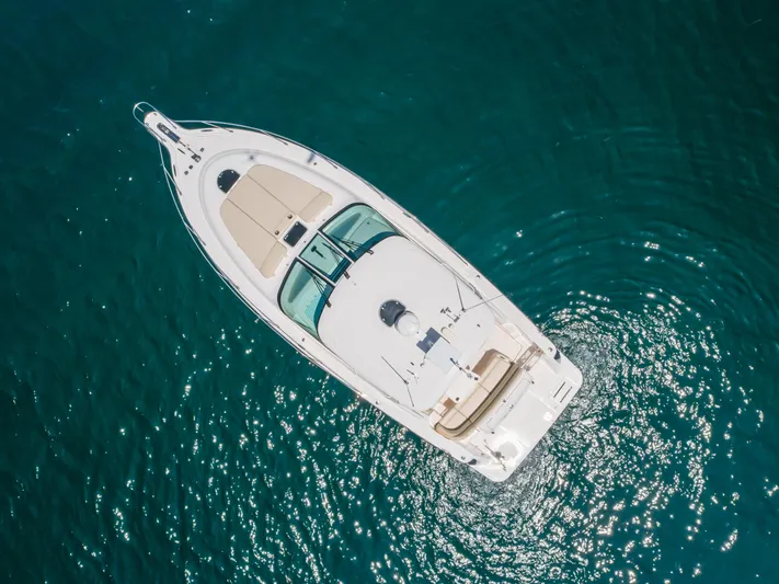 Worked The Plan Yacht Photos Pics Aerial view of 2009 Tiara Yachts 3900 Sovran on clear blue water.