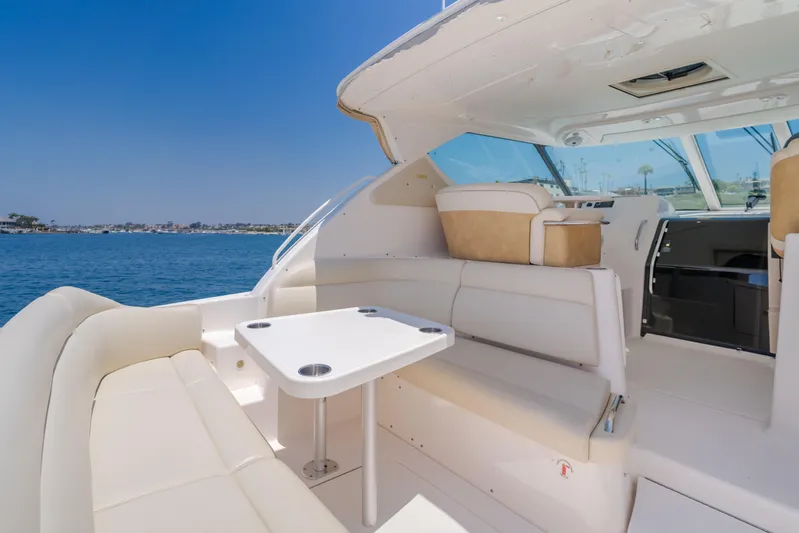 Worked The Plan Yacht Photos Pics 2009 Tiara Yachts 3900 Sovran interior with seating and table, overlooking the ocean.