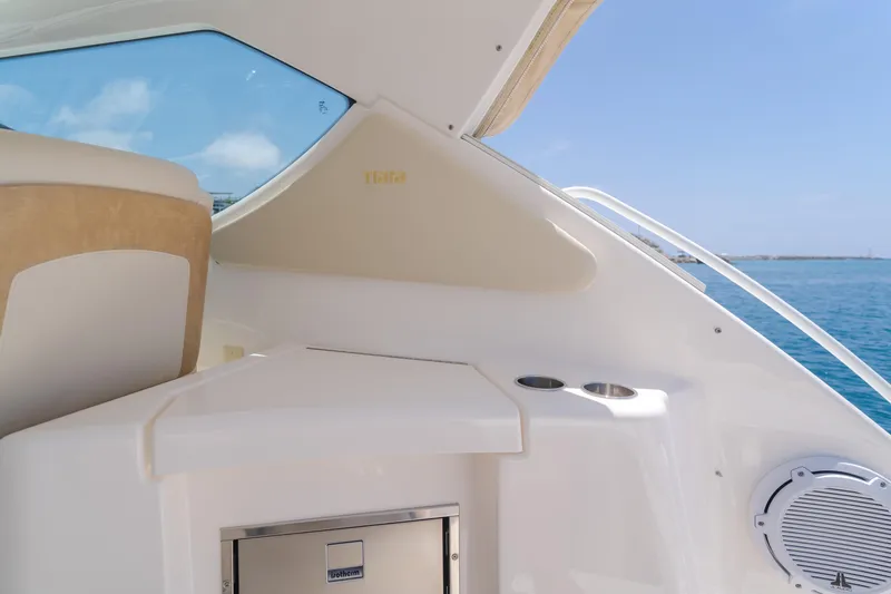 Worked The Plan Yacht Photos Pics 2009 Tiara Yachts 3900 Sovran interior with ocean view, featuring seating and storage.