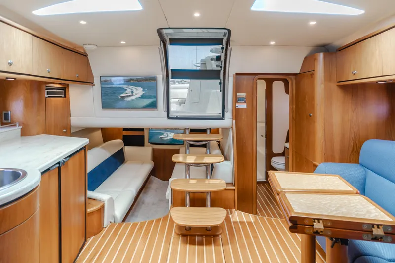 Worked The Plan Yacht Photos Pics Luxurious interior of 2009 Tiara Yachts 3900 Sovran with wood finishes and modern amenities.