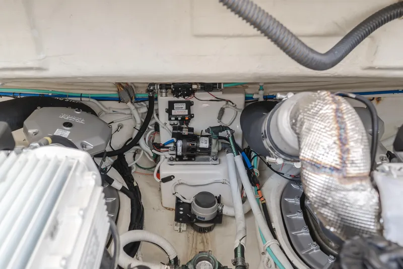 Worked The Plan Yacht Photos Pics Engine room of 2009 Tiara Yachts 3900 Sovran, showcasing mechanical components and wiring.