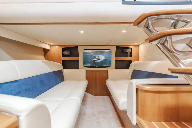 Worked The Plan Yacht Photos Pics Luxurious interior of 2009 Tiara Yachts 3900 Sovran with plush seating and modern amenities.