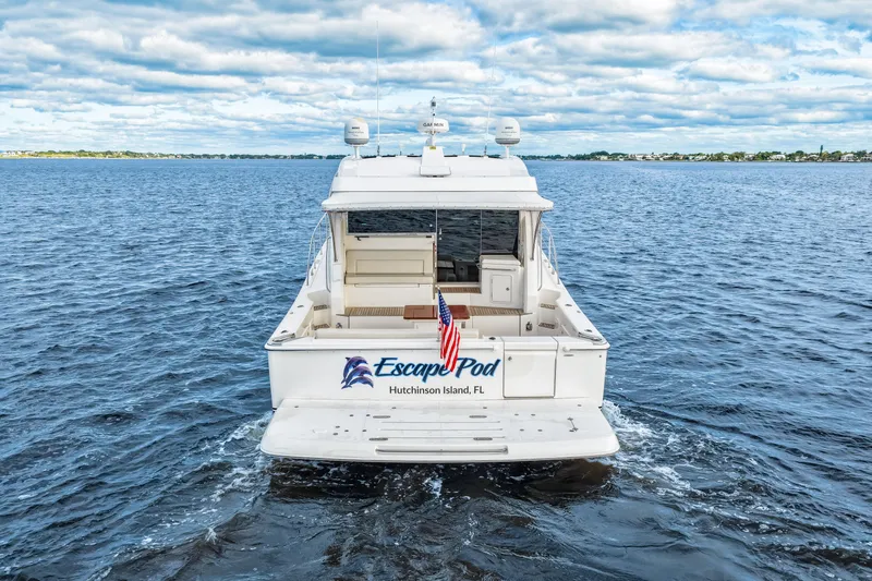 Escape Pod Yacht Photos Pics 2015 Riviera 565 SUV yacht "Escape Pod" on open water, Hutchinson Island, FL.