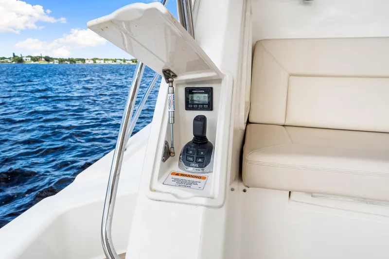 Escape Pod Yacht Photos Pics 2015 Riviera 565 SUV control panel and seating by the water.