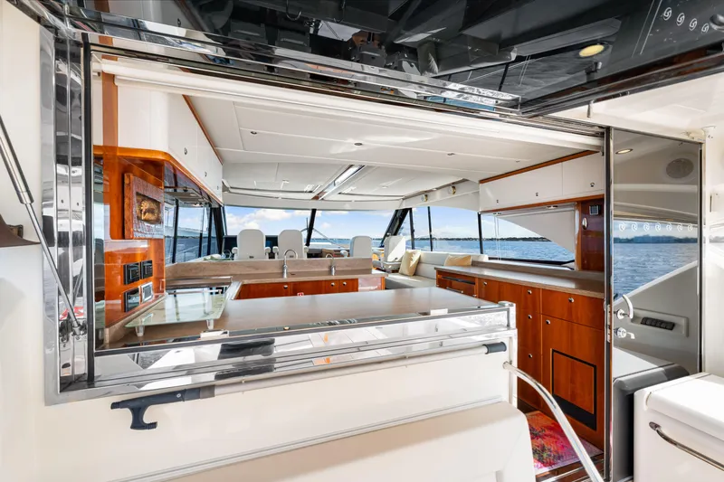 Escape Pod Yacht Photos Pics Luxurious interior of 2015 Riviera 565 SUV yacht with ocean view.