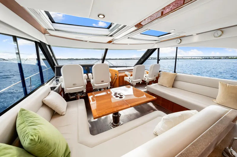 Escape Pod Yacht Photos Pics Luxurious interior of 2015 Riviera 565 SUV yacht with panoramic ocean views.