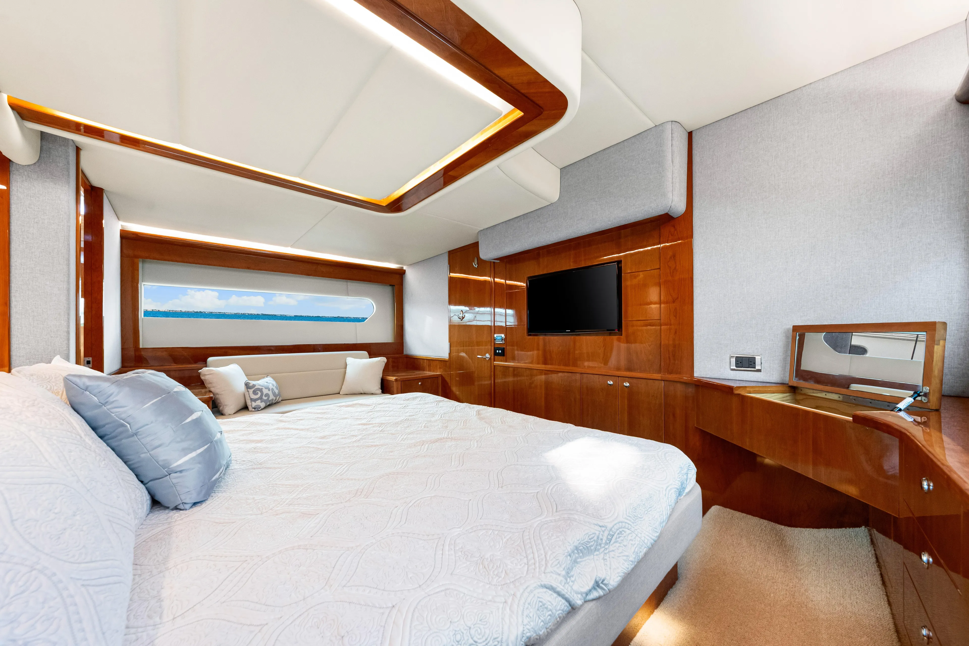 Escape Pod Yacht Photos Pics Luxurious interior of 2015 Riviera 565 SUV yacht with elegant wood finishes and modern amenities.