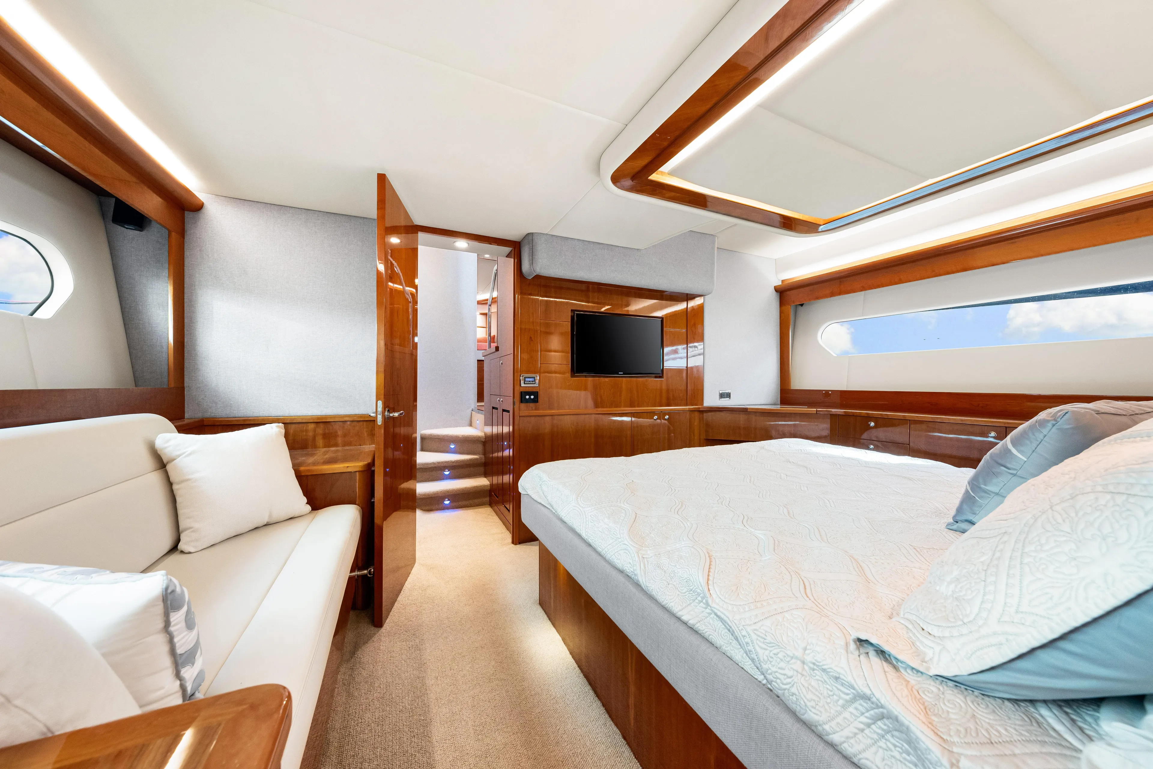 Escape Pod Yacht Photos Pics Luxurious interior of 2015 Riviera 565 SUV yacht with elegant wood finishes and modern amenities.