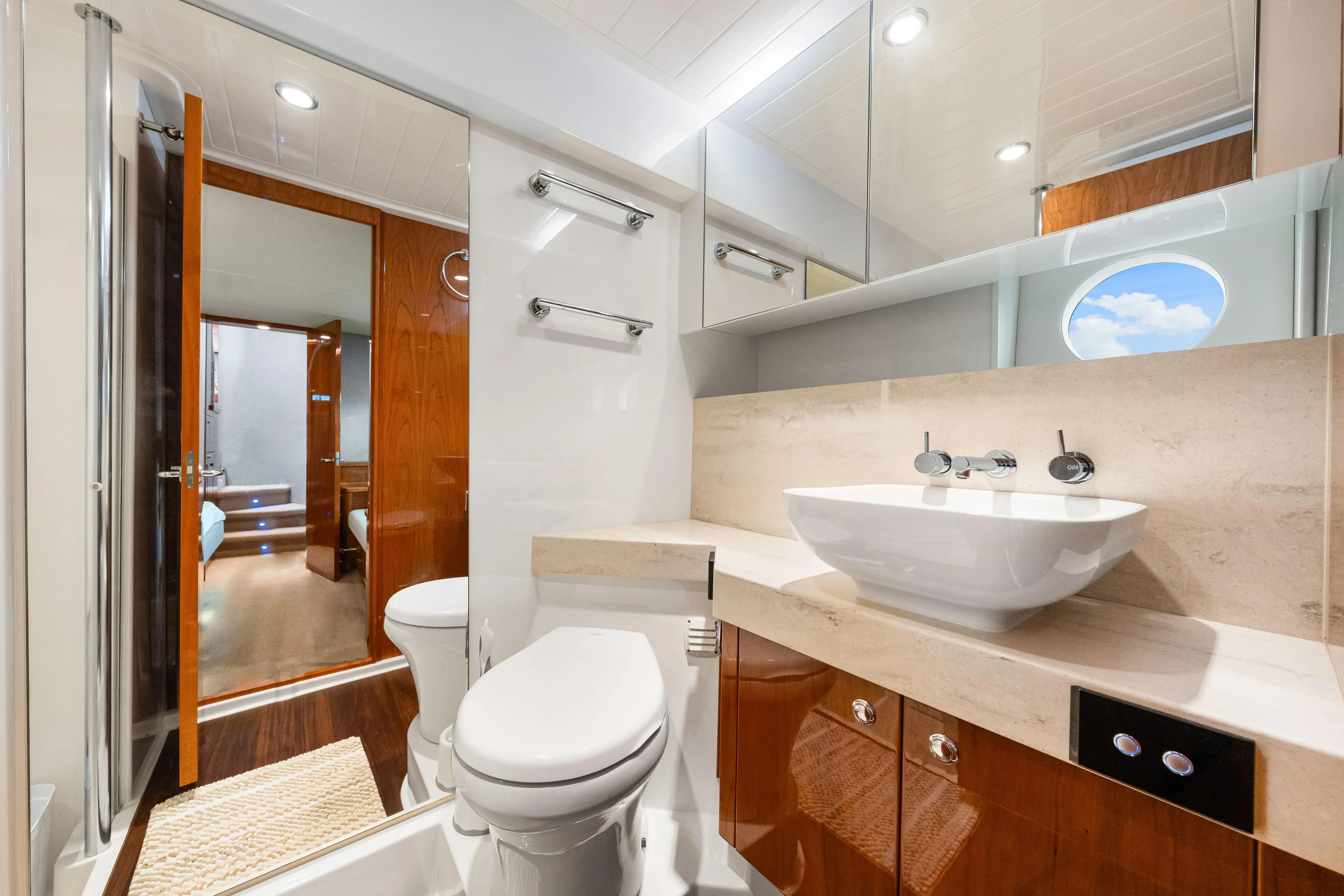 Escape Pod Yacht Photos Pics Luxurious bathroom interior of 2015 Riviera 565 SUV yacht with modern fixtures.