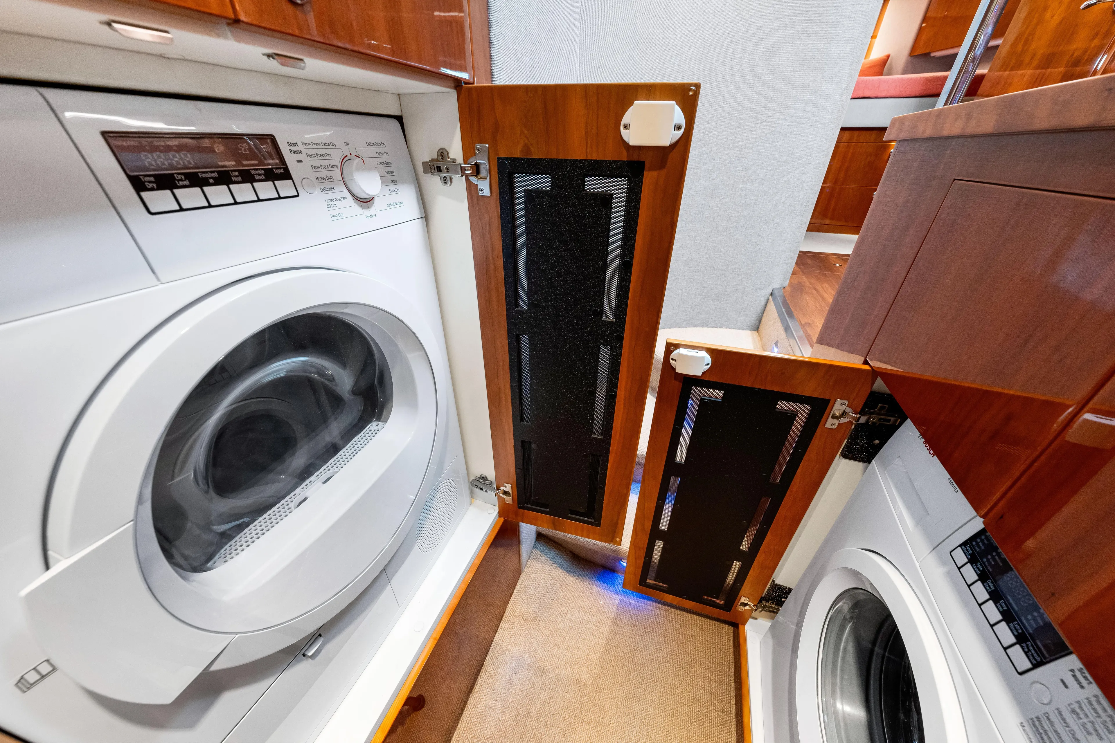 Escape Pod Yacht Photos Pics Laundry area inside 2015 Riviera 565 SUV yacht with washer and dryer.