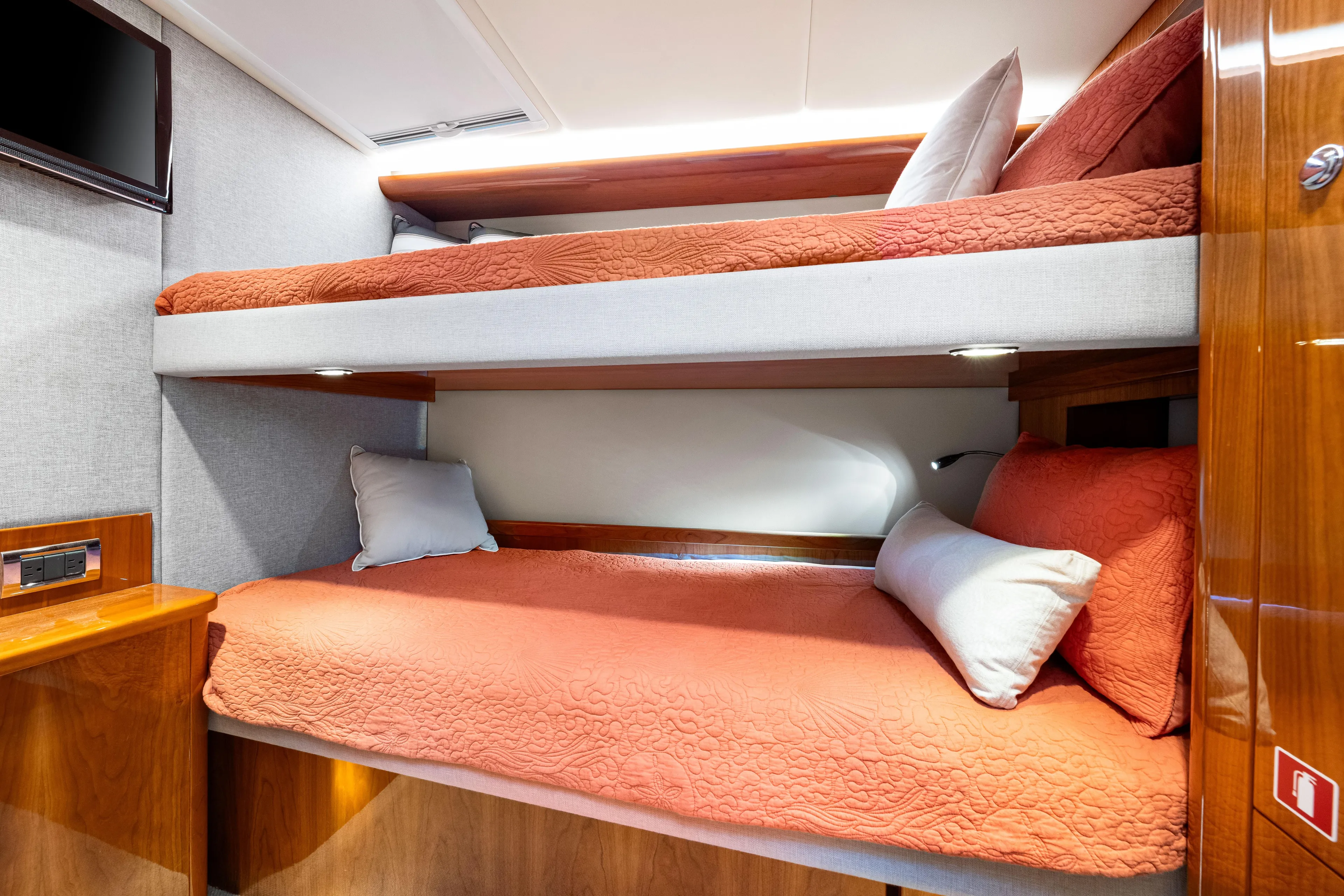 Escape Pod Yacht Photos Pics Interior of 2015 Riviera 565 SUV with cozy bunk beds and modern design.