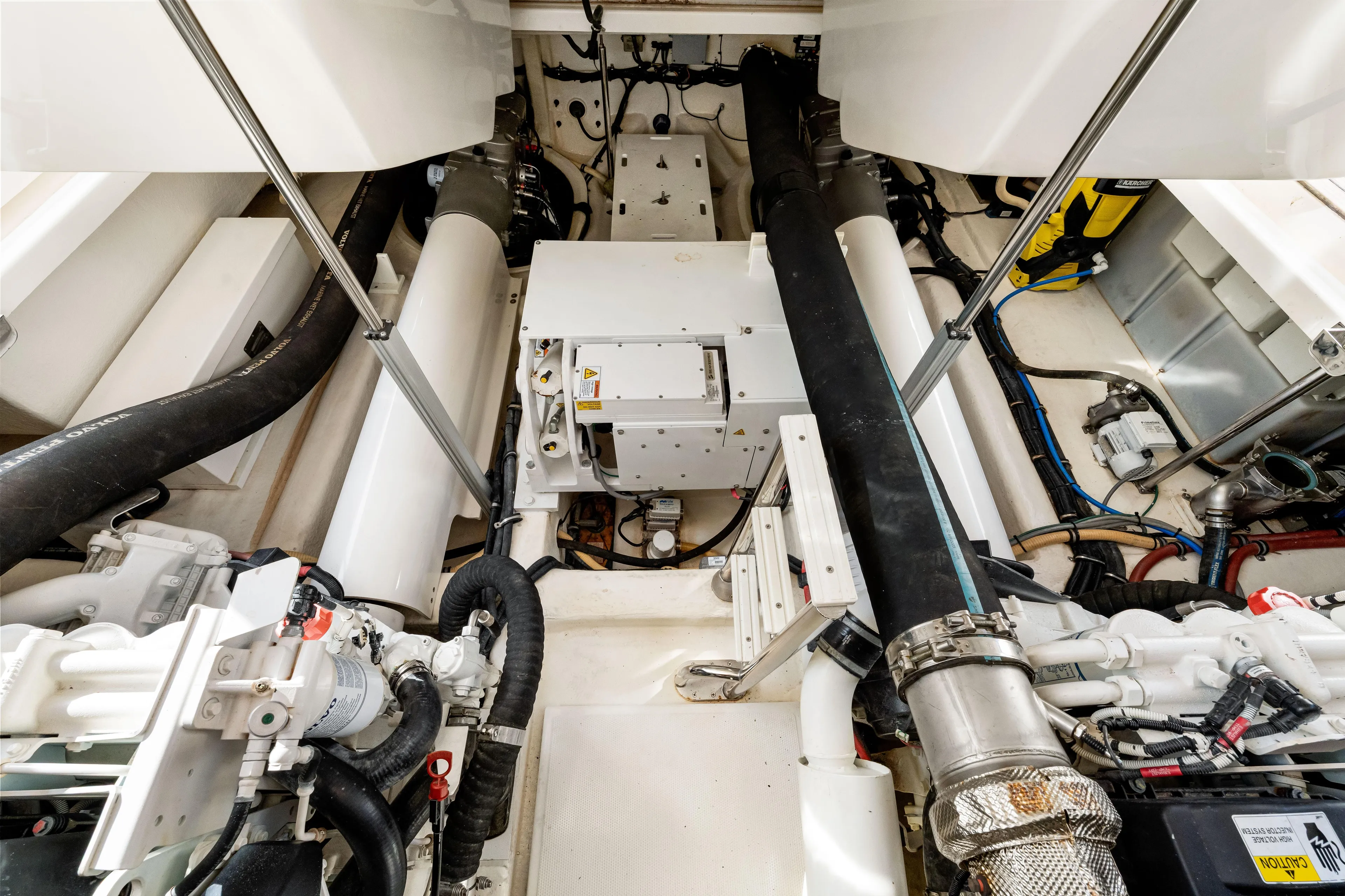 Escape Pod Yacht Photos Pics Engine room of 2015 Riviera 565 SUV yacht, showcasing mechanical components and systems.