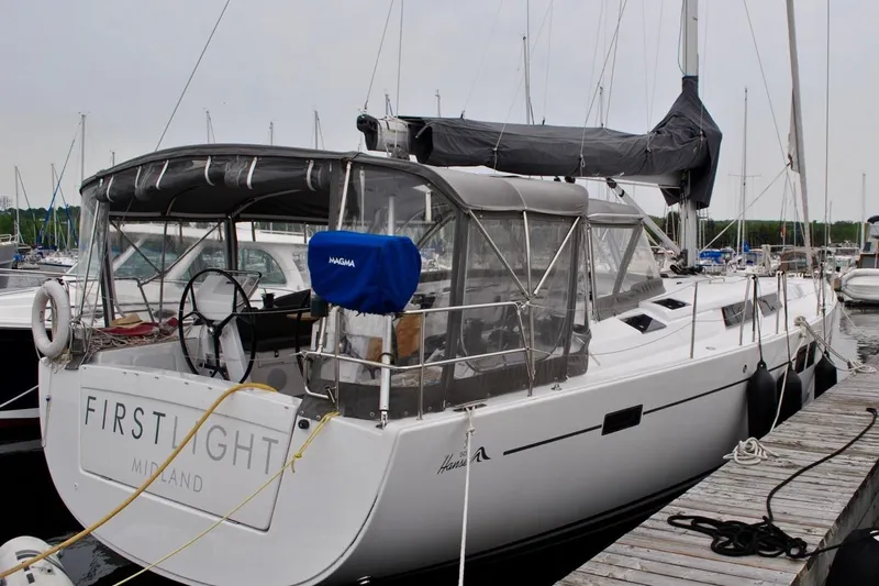 First Light Yacht Photos Pics 2017 Hanse 505 sailboat docked at marina, featuring covered cockpit and sleek design.