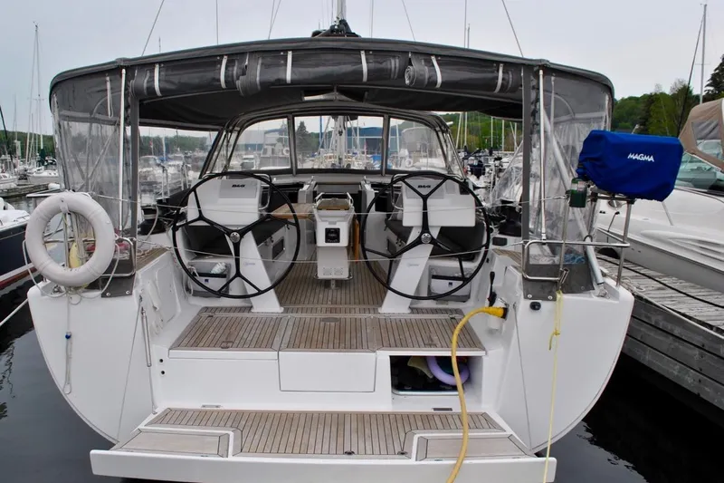 First Light Yacht Photos Pics 2017 Hanse 505 yacht docked, featuring dual steering wheels and spacious cockpit.
