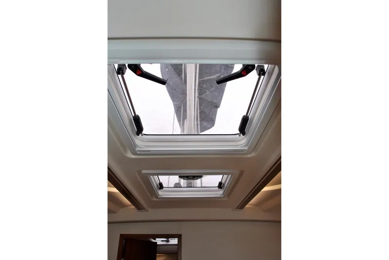 First Light Yacht Photos Pics Interior view of 2017 Hanse 505 yacht skylight, showcasing modern design and functionality.