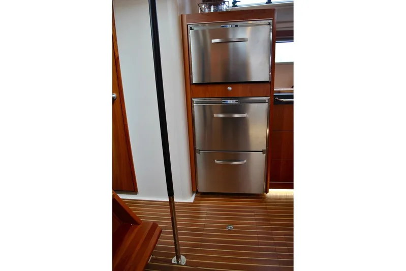 First Light Yacht Photos Pics Stainless steel appliances in 2017 Hanse 505 yacht interior with wooden flooring.