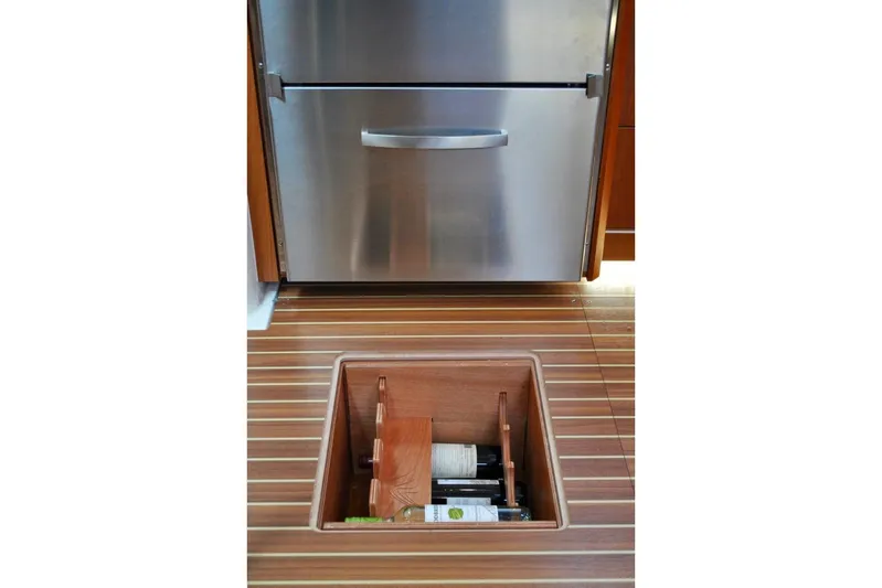 First Light Yacht Photos Pics Hidden wine storage in 2017 Hanse 505 yacht with stainless steel fridge.