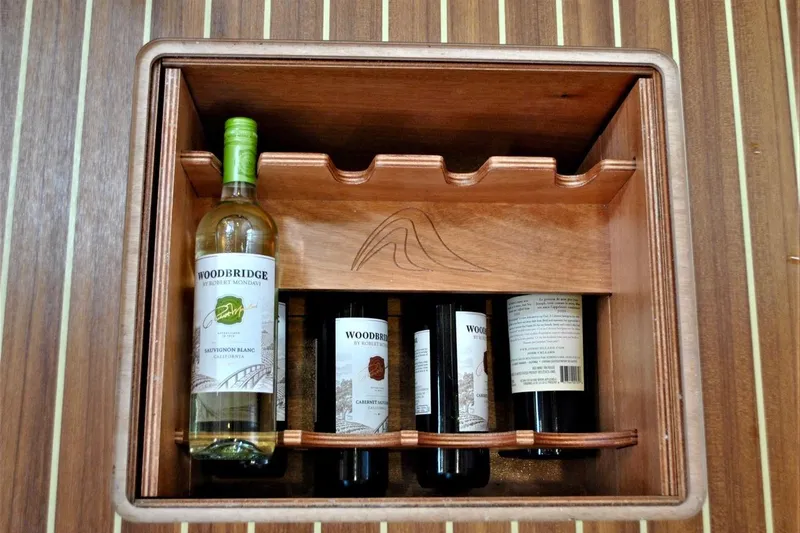First Light Yacht Photos Pics Wine rack on 2017 Hanse 505 yacht with Woodbridge bottles.