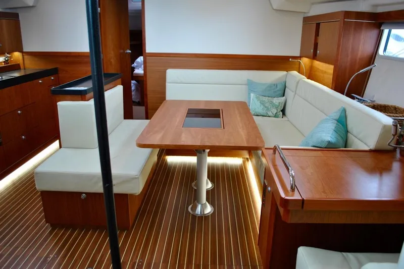 First Light Yacht Photos Pics Luxurious interior of 2017 Hanse 505 yacht with elegant wood and cream seating.