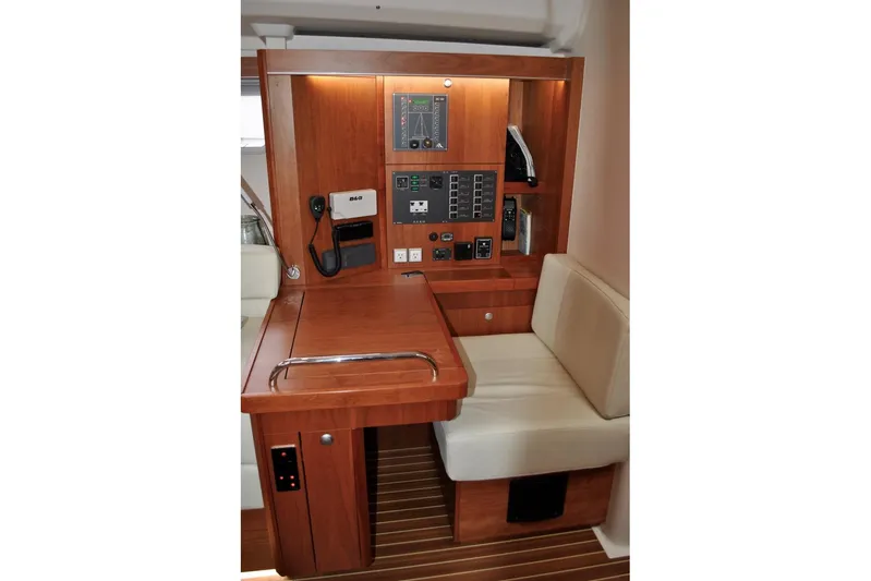 First Light Yacht Photos Pics Navigation station of 2017 Hanse 505 yacht with control panel and seating.