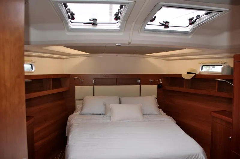 First Light Yacht Photos Pics Luxurious cabin interior of 2017 Hanse 505 yacht with skylights and wooden finish.