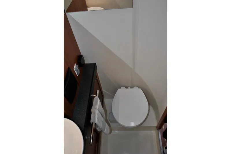 First Light Yacht Photos Pics Compact bathroom in 2017 Hanse 505 yacht with modern fixtures and white toilet.