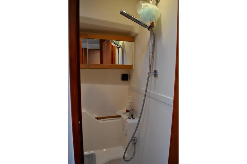 First Light Yacht Photos Pics Compact bathroom in 2017 Hanse 505 yacht with shower and mirror cabinet.